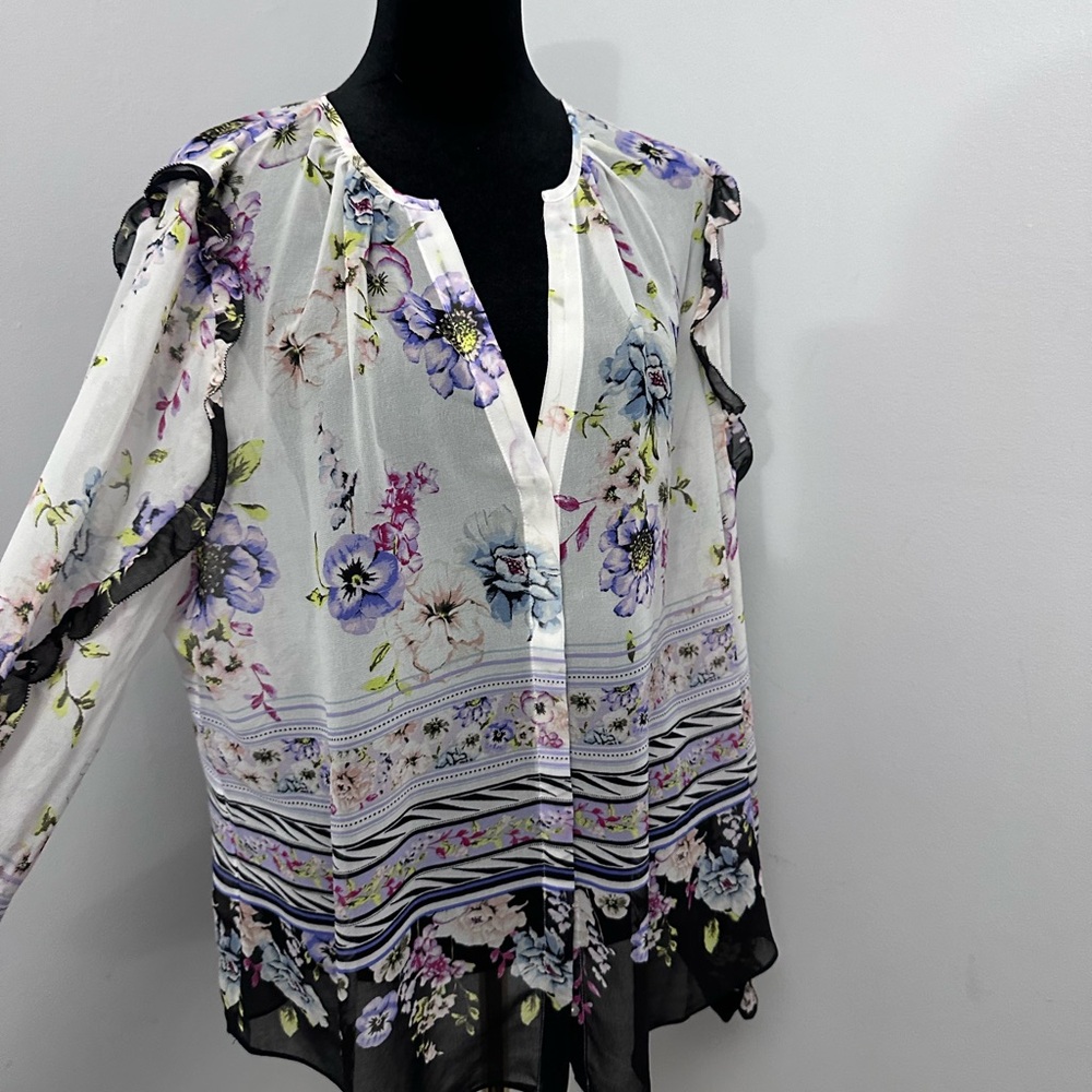 WHBM blouse with ruffle detailing along the sleeves.